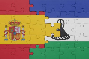 Lesotho ve İspanya bayrağının renkli ulusal bayrağıyla bulmaca. konsept