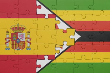 Zimbabwe 'nin renkli ulusal bayrağı ve İspanya bayrağı ile bulmaca. konsept