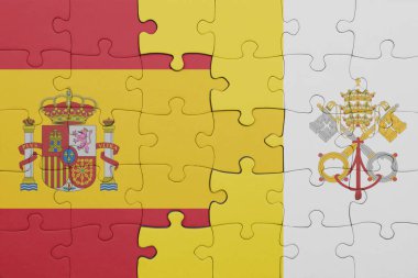 İspanya bayrağı ve Vatikan 'ın renkli ulusal bayrağının bulmacası. konsept