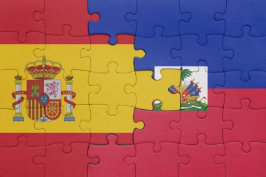 Haiti 'nin renkli ulusal bayrağı ve İspanya bayrağı ile bulmaca. konsept