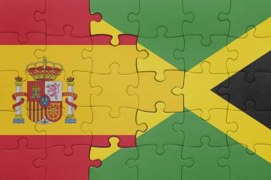 Jamaika 'nın renkli ulusal bayrağı ve İspanya bayrağının bulmacası. konsept