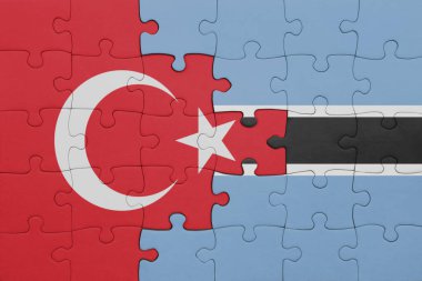 Botswana 'nın renkli ulusal bayrağı ve hindi bayraklarıyla dolu bir yapboz. konsept