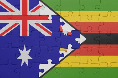 Zimbabwe 'nin renkli ulusal bayrağı ve Avustralya bayrağı ile bulmaca. konsept
