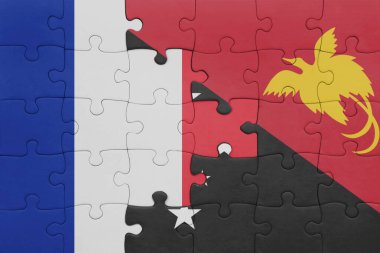 Papua Yeni Gine 'nin renkli ulusal bayrağı ve Fransa bayrağı. konsept