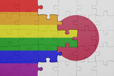 Japonya 'nın renkli ulusal bayrağı ve gökkuşağı gay gurur bayrağı ile bulmaca. konsept