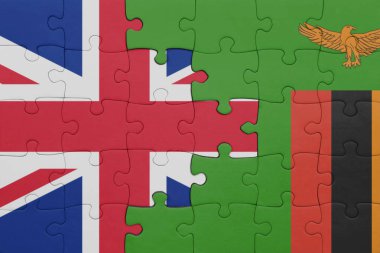 Zambiya 'nın renkli ulusal bayrağı ve Büyük Britanya bayrağı ile bulmaca. konsept