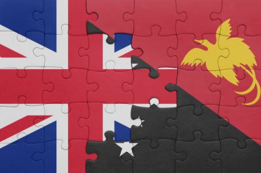 Papua Yeni Gine 'nin renkli ulusal bayrağı ve Büyük Britanya bayrağı. konsept