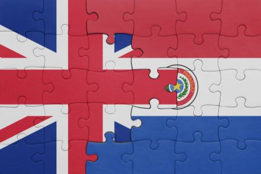 Paraguay 'ın renkli ulusal bayrağı ve Büyük Britanya bayrağı ile bulmaca. konsept