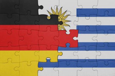 Uruguay 'ın renkli ulusal bayrağı ve Almanya bayrağı ile ilgili bulmacalar. konsept