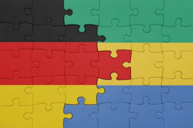 Gabon 'un renkli ulusal bayrağı ve Almanya bayrağı ile bulmaca. konsept