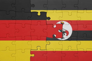Uganda 'nın renkli ulusal bayrağı ve Almanya bayrağı. konsept