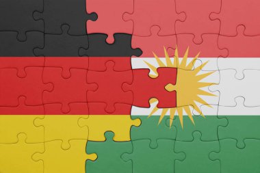 Kürdistan 'ın renkli ulusal bayrağı ve Almanya bayrağıyla ilgili bulmacalar. konsept
