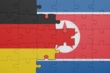 Kuzey Kore 'nin renkli ulusal bayrağı ve Almanya bayrağıyla ilgili bulmacalar. konsept