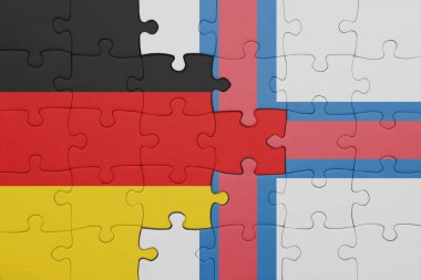 Faroe Adaları 'nın renkli ulusal bayrağı ve Almanya bayrağı. konsept