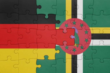 Dominica 'nın renkli ulusal bayrağı ve Almanya bayrağının bulmacası. konsept