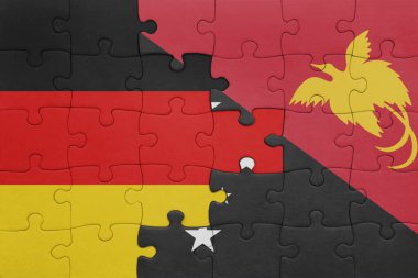 Papua Yeni Gine 'nin renkli ulusal bayrağı ve Almanya bayrağı. konsept
