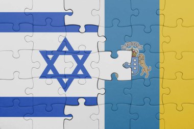 Kanarya adalarının renkli ulusal bayrağı ve İsrail bayrağıyla bulmaca. konsept