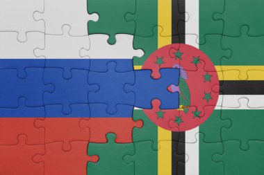 Dominika 'nın renkli ulusal bayrağı ve Rusya bayrağıyla ilgili bulmacalar. konsept