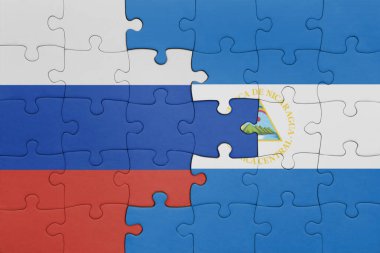 Nikaragua 'nın renkli ulusal bayrağı ve Rusya bayrağının bulmacası. konsept