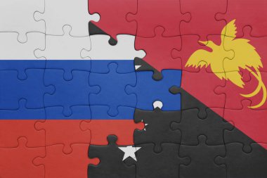 Papua Yeni Gine 'nin renkli ulusal bayrağı ve Rusya bayrağı. konsept