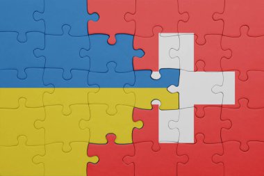İsviçre 'nin renkli ulusal bayrağı ve Ukrayna bayrağı. konsept