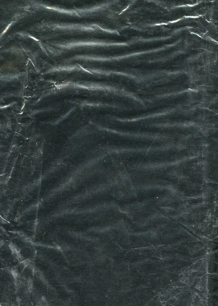 Textura Polietileno Arrugado Sobre Fondo Oscuro —  Fotos de Stock