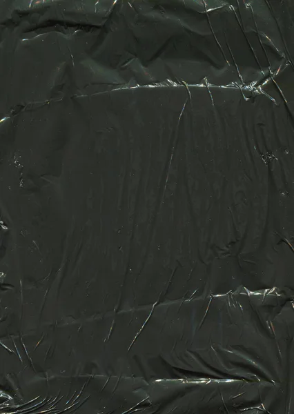 Černá Zmačkaný Lesklý Polyethylen Pozadí — Stock fotografie