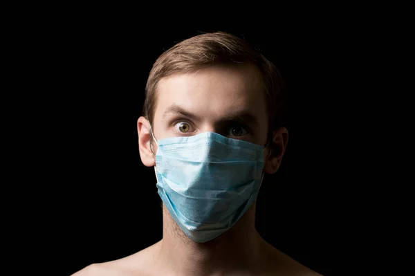 portrait of a masked face against viruses