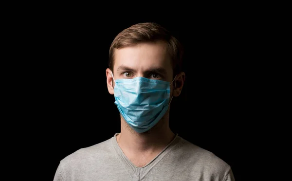 portrait of a masked face against viruses