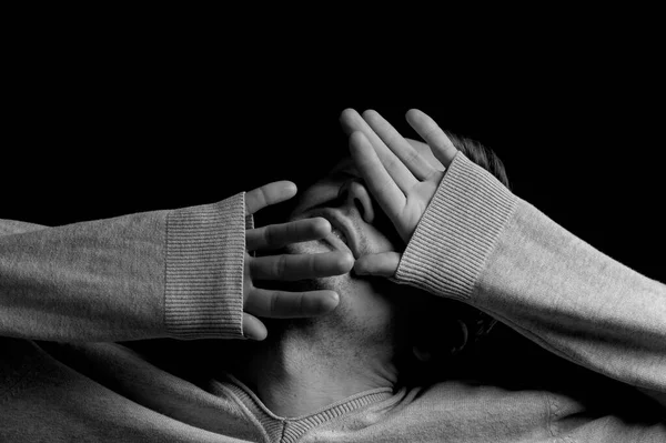 Man Black Background Covers His Face His Hands — Stock Photo, Image