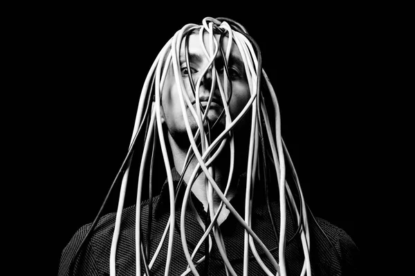 black and white photo, large portrait of a man in a shirt, the wires go out of  head concept human globalization