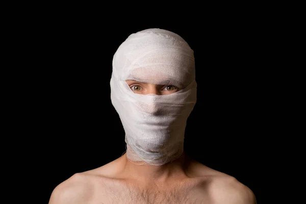 portrait of a guy head wrapped in a bandage