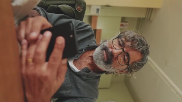 Vertical Video Elderly Man Hands Typing Mobile Phone — Stock Video