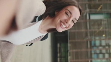Student filming herself on a mobile phone