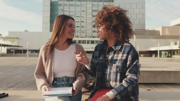 Beautiful Joyful Female Students Emotionally Share News Laugh While Sitting — Stockvideo