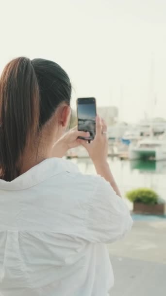 Vertical Video Young Woman Taking Photo Sea Port Mobile Phone — Stockvideo