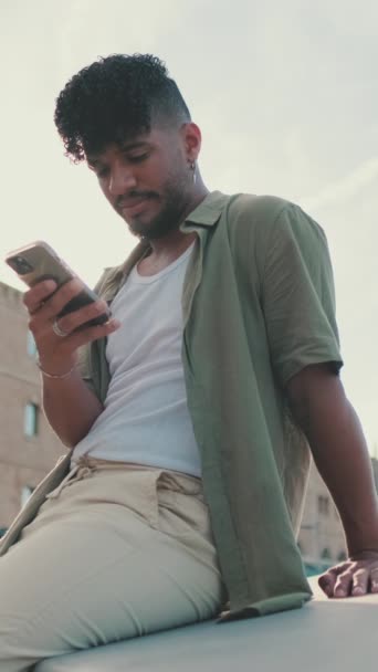 Vertical Video Young Man Dressed Olive Colored Shirt Sitting Waterfront — Wideo stockowe