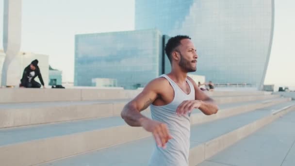 Young Bearded Male Athlete Jumps Makes Movements His Hands Workout — Vídeos de Stock