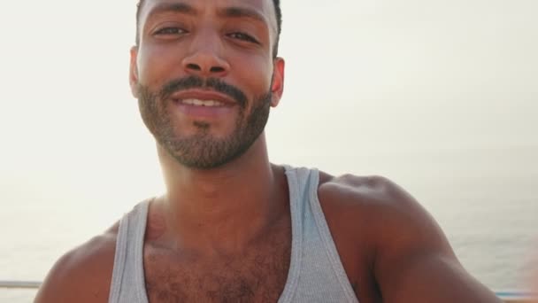 Young Bearded Male Fit Athlete Uses Cell Phone Makes Video — Vídeos de Stock