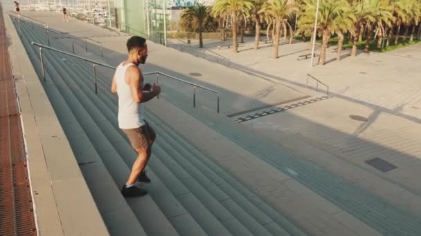 Young Bearded Male Fit Athlete Doing Workout Running Steps — Stockvideo