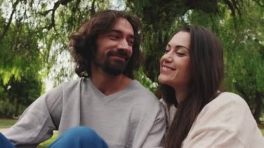 Closeup, loving couple spending time on romantic dating at picnic