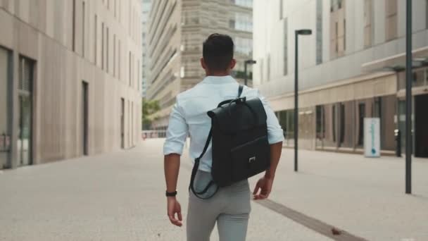 Young Businessman Walking Business District Back View — Stockvideo