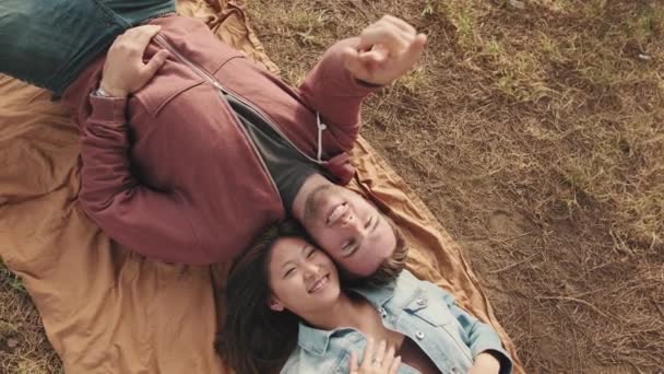 Young Couple Lying Blanket Park — Vídeo de Stock