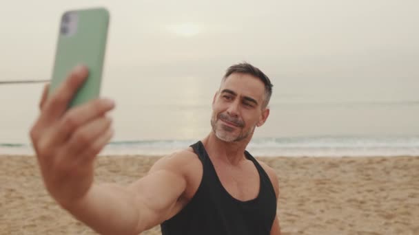 Mature Man Makes Selfie While Standing Seascape Background — Stock Video