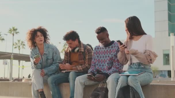 Students Sit Next University Building Looking Mobile Phones Talking — Stock Video