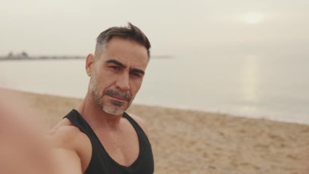 Close Mature Man Makes Selfie While Standing Seascape Background — Stock Video