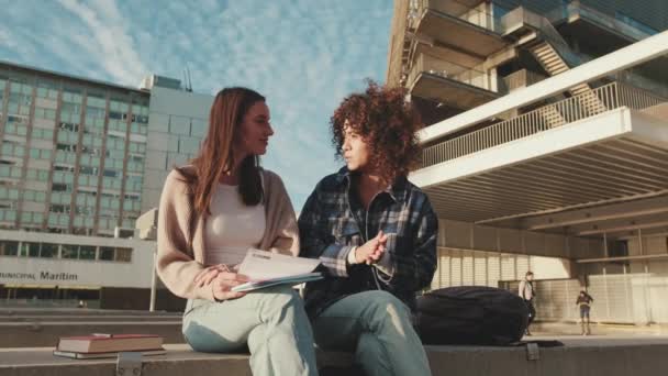 Beautiful Joyful Female Students Emotionally Share News Laugh While Sitting — Stock video