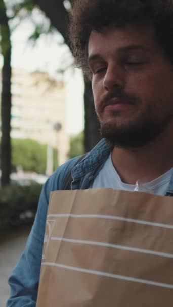 Young Happy Man Walking Street Bag Food — Stock Video