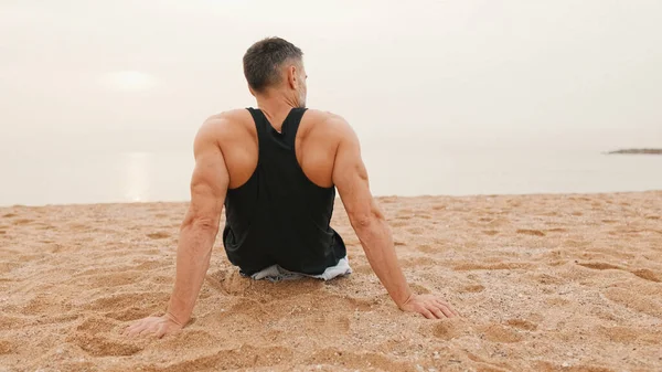 Middle Aged Athletic Man Sits Beach Workout Looks Sea Back — Stock Photo, Image