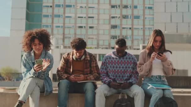 Group Students Sit Next University Building Looking Mobile Phones — Stock Video